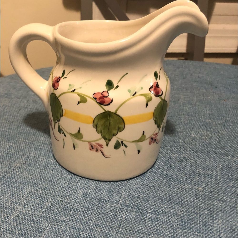 White pitcher with hand painted flowers.